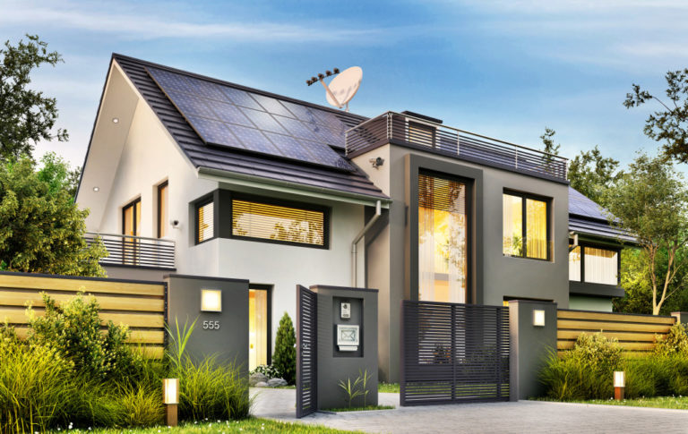Beautiful modern house with garden and solar panels on the gable roof