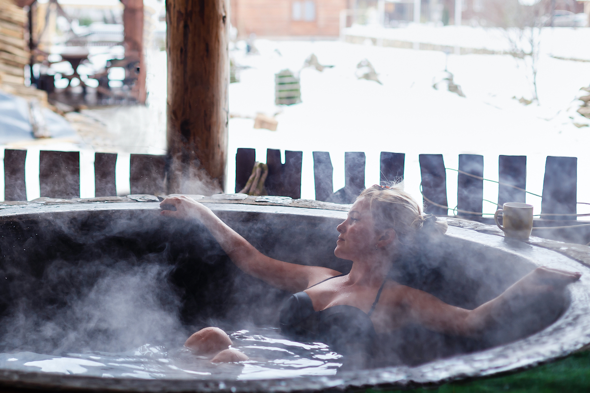 woman having a hot bath outside