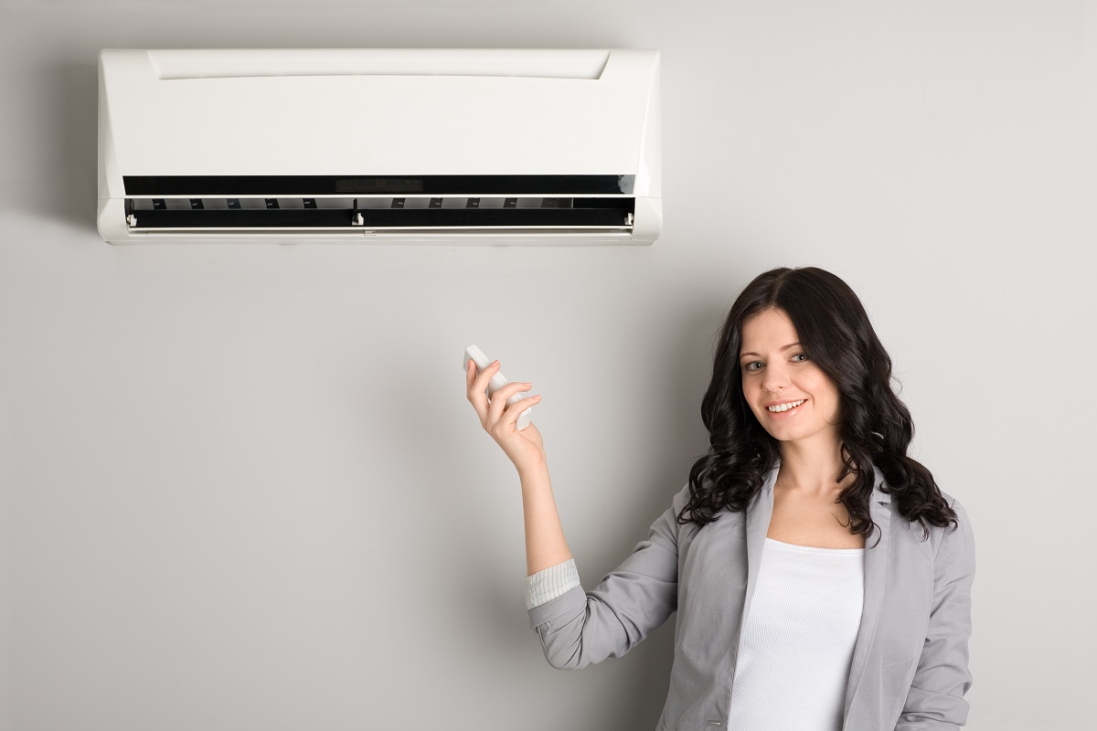 Woman and air conditioner