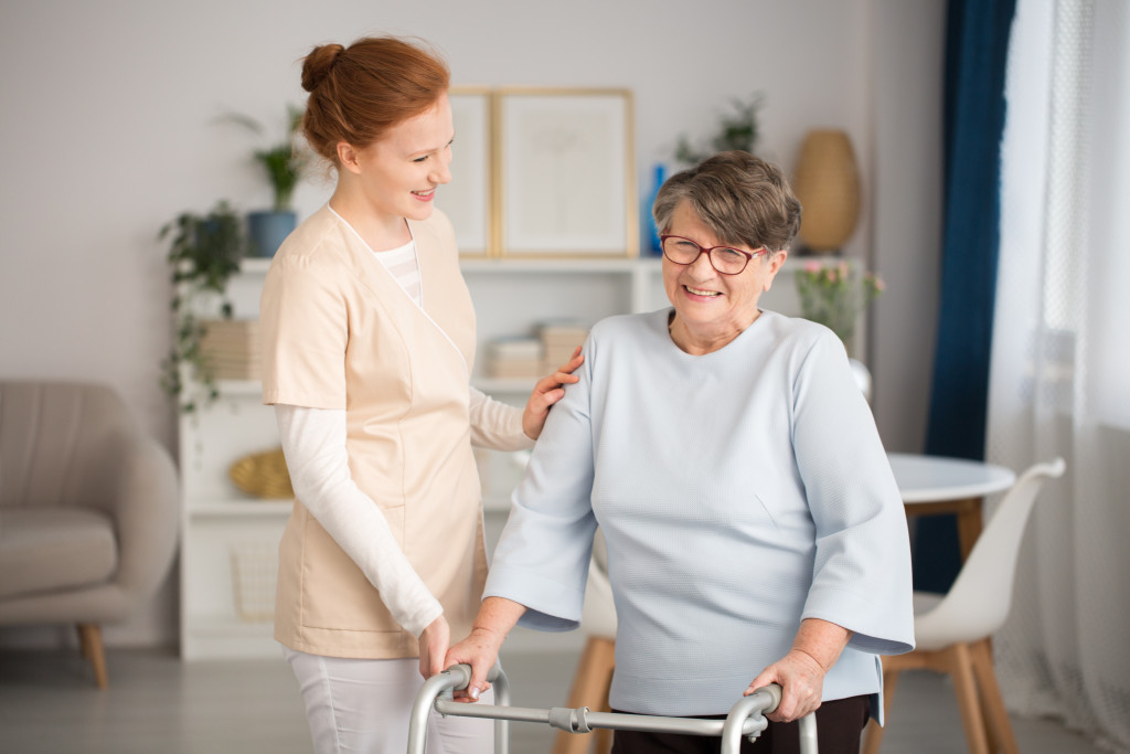 caregiver assisting an elderly