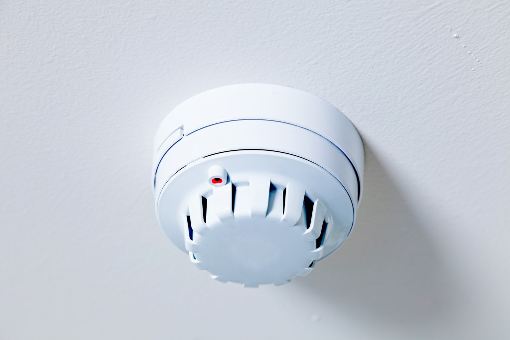 Smoke detector installed on the ceiling of a house.