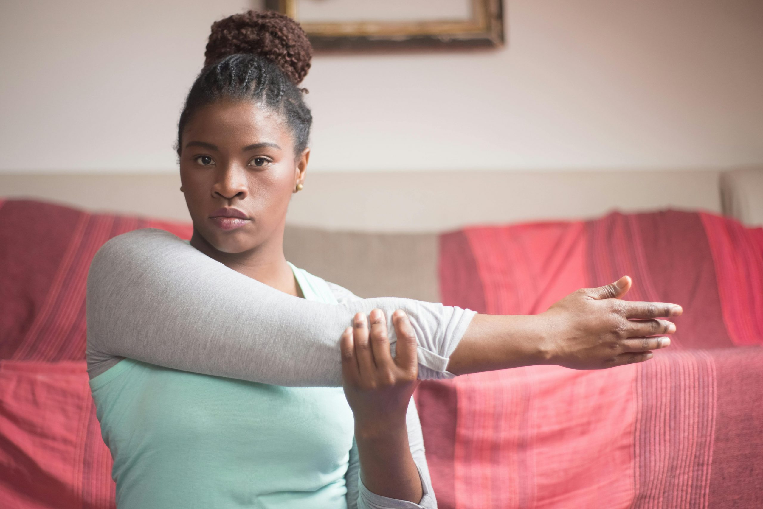 woman doing a side arm stretch